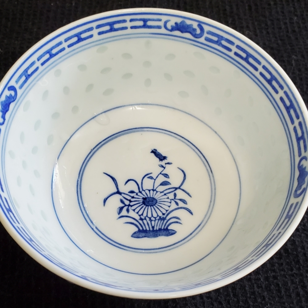 Vintage Chinese Porcelain Bowl with Blue White Flower Rice Grain Pattern.